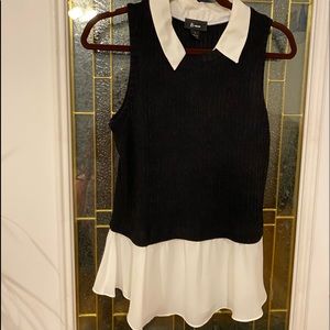 Sophisticated BWear women’s sleeveless top, black & white, w/ white flouncy hem.